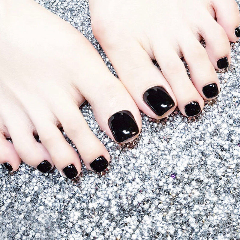 Glossy black toe nails