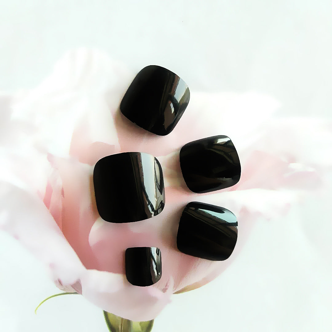 Glossy black toe nails